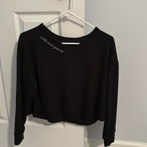 Black cropped Justice sweatshirt.
